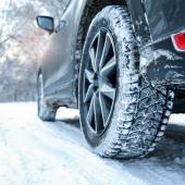 Snowy country road with car on winter day, closeup. Space for text, Snowy country road with car on winter day, closeup. Space for te